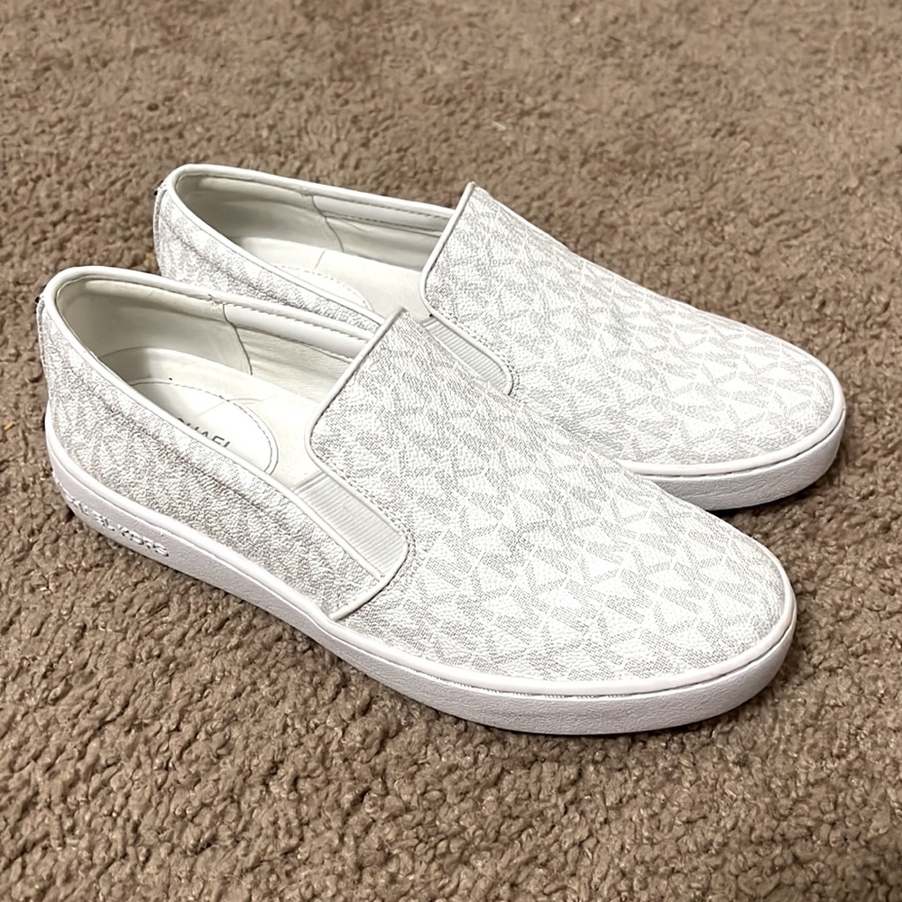 Only worn once MK shoes . Like new condition